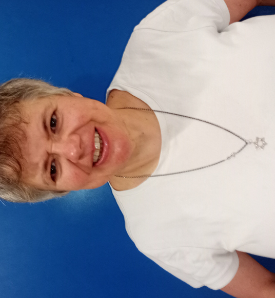 Simone Aspis wearing a Star of David necklace